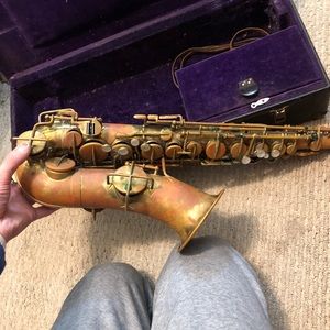 Vintage saxophone with case and pieces, low pitch